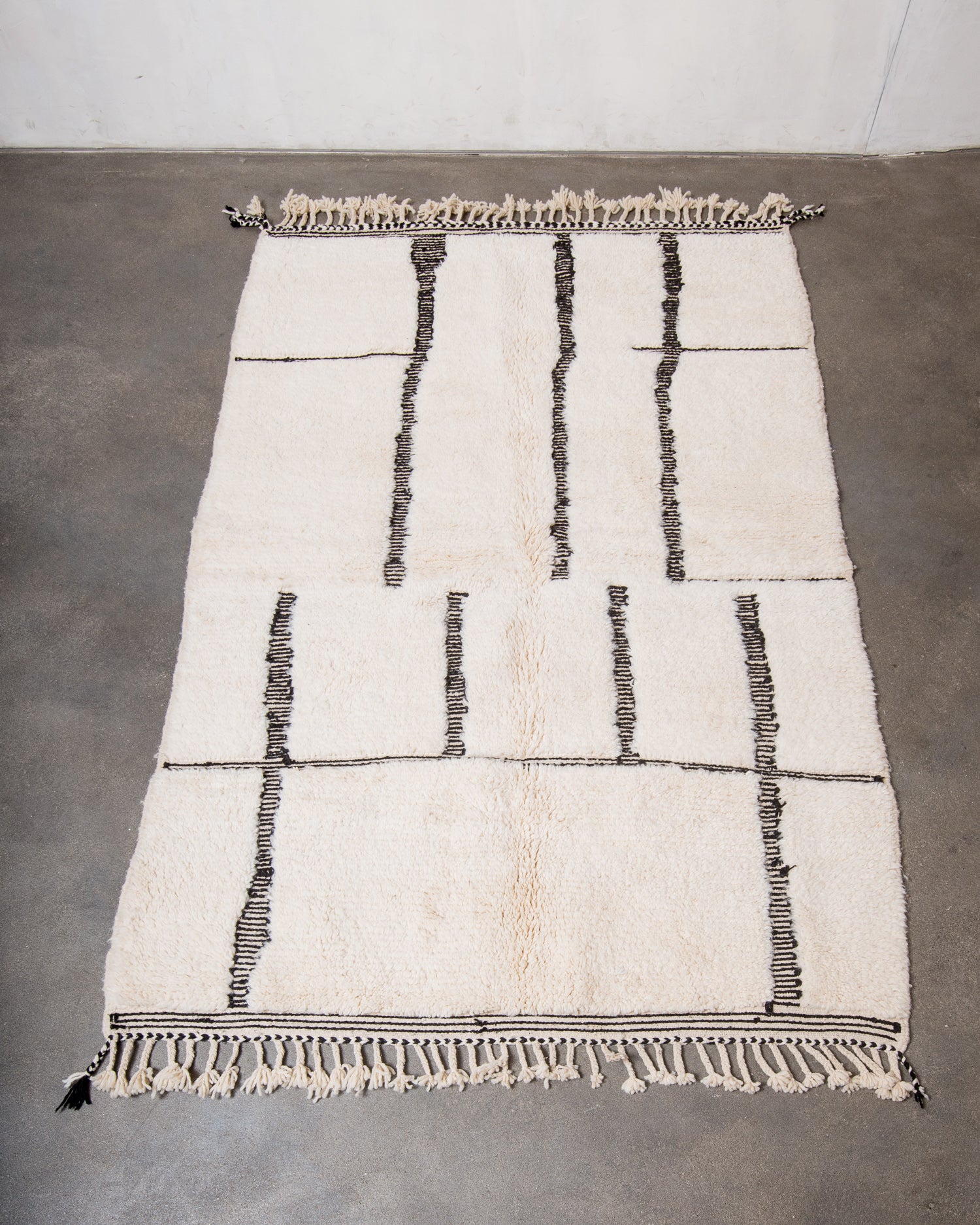 Modern, designer, handcrafted Berber rug from Morocco. Beniourain carpet with minimalist design, natural wool pile and a fluffy texture.